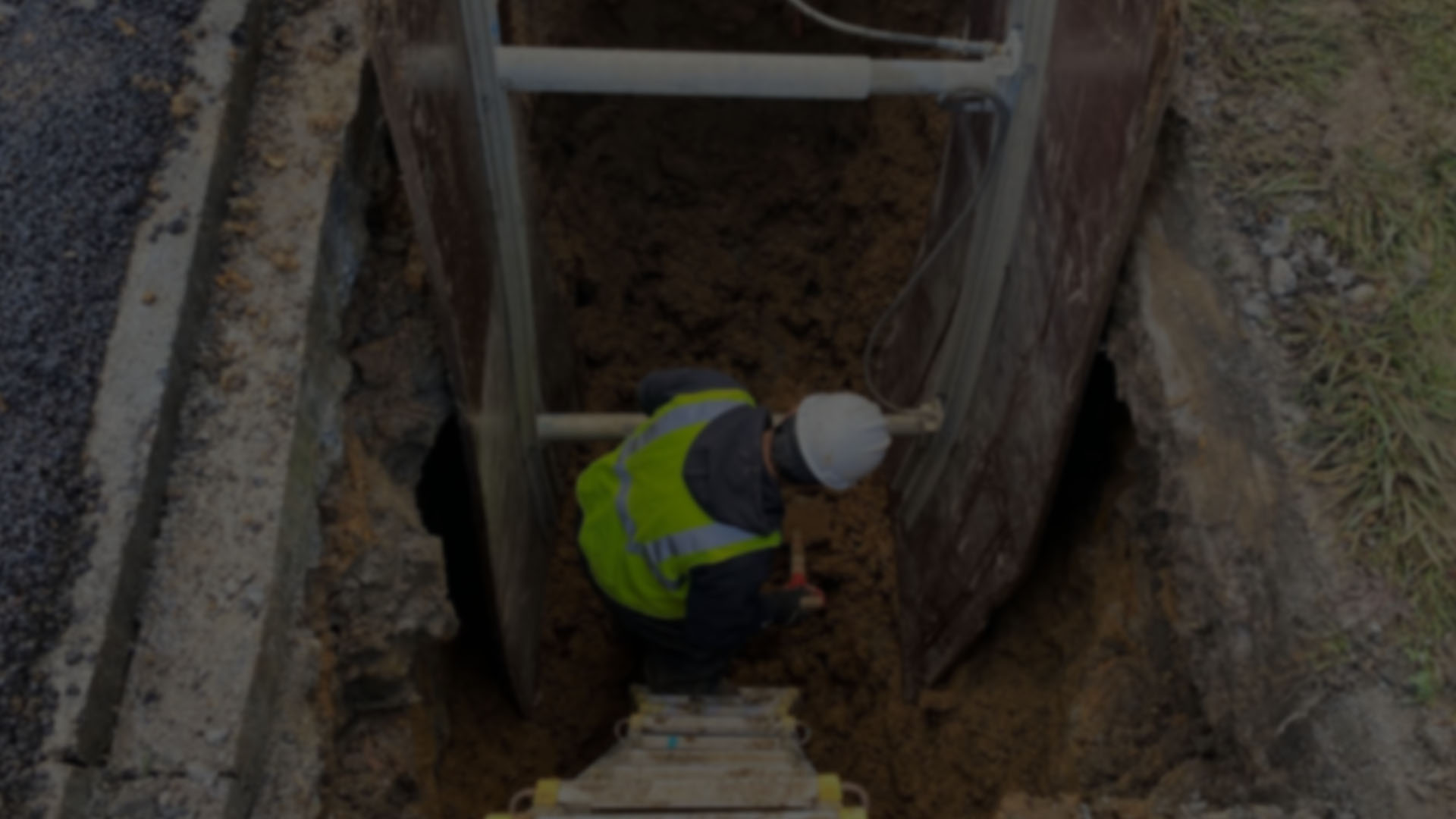 Crew member working in a sewer trench at a coastal Oregon site